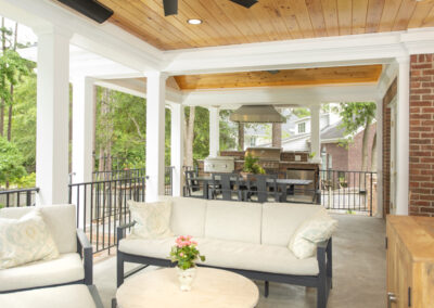 Beautiful porch lounge area with outdoor kitchen